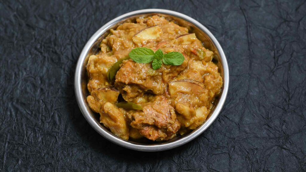 Chicken Curry in a bowl with a dark background
