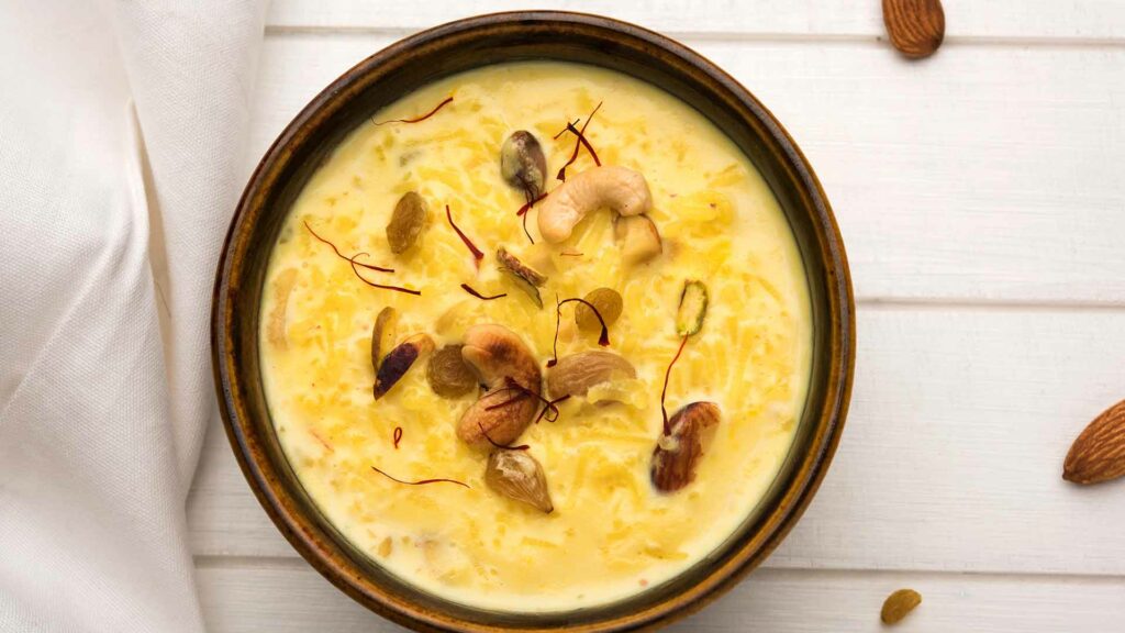 Pasi Paruppu Badam Payasam Recipe in a brown bowl and placed in a white background