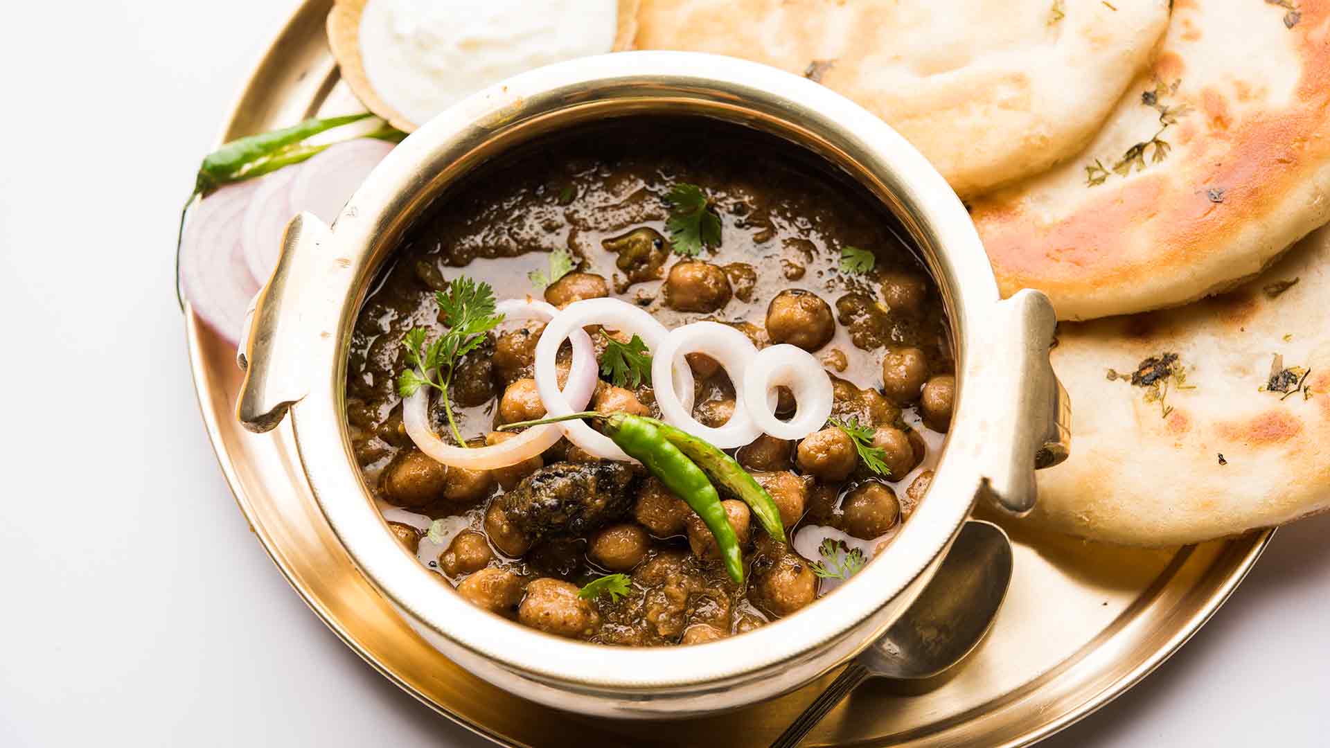 Pindi Chana in a bowl with chapatis