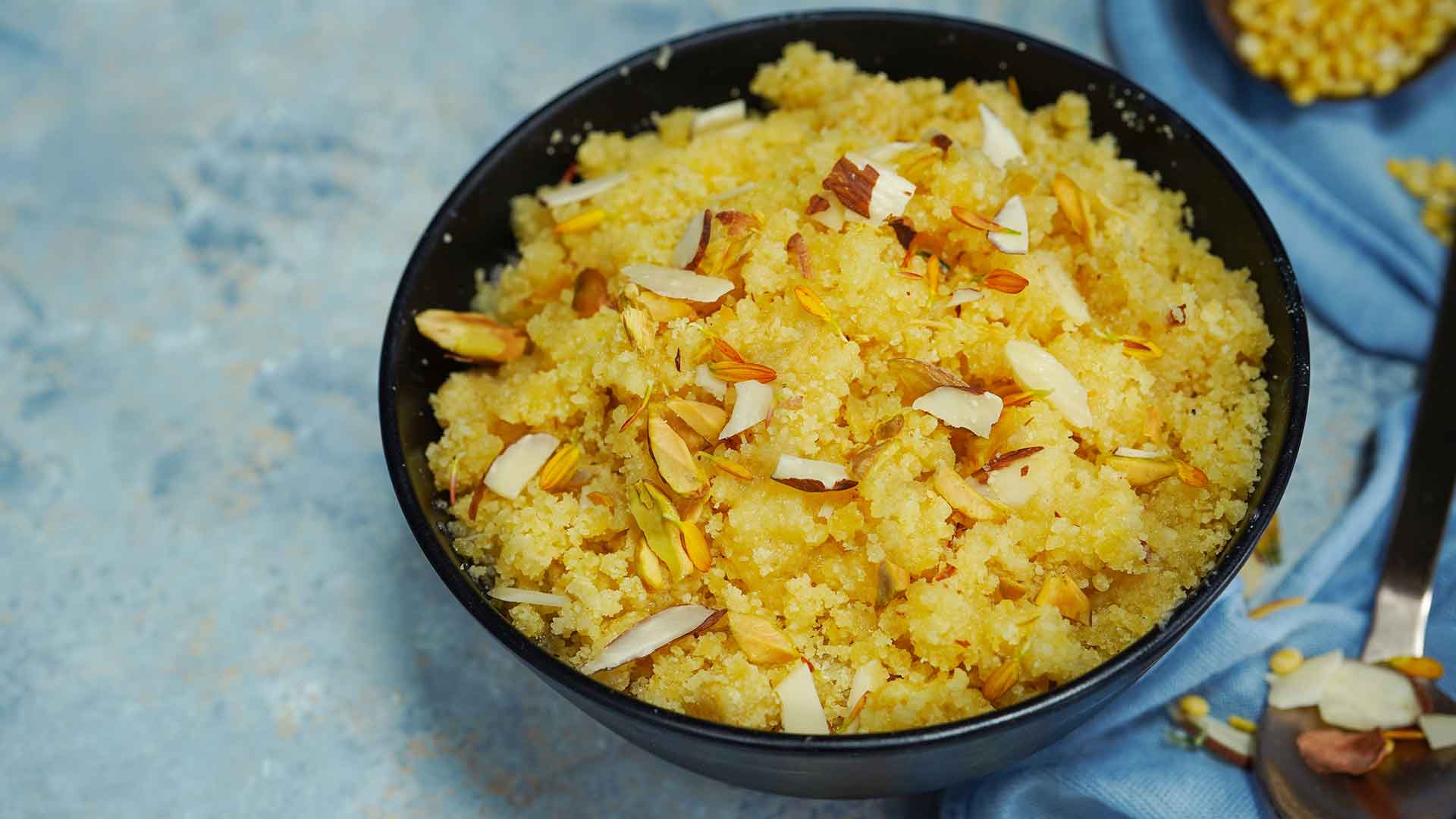 Pumpkin Halwa in a black bowl with sky blue background